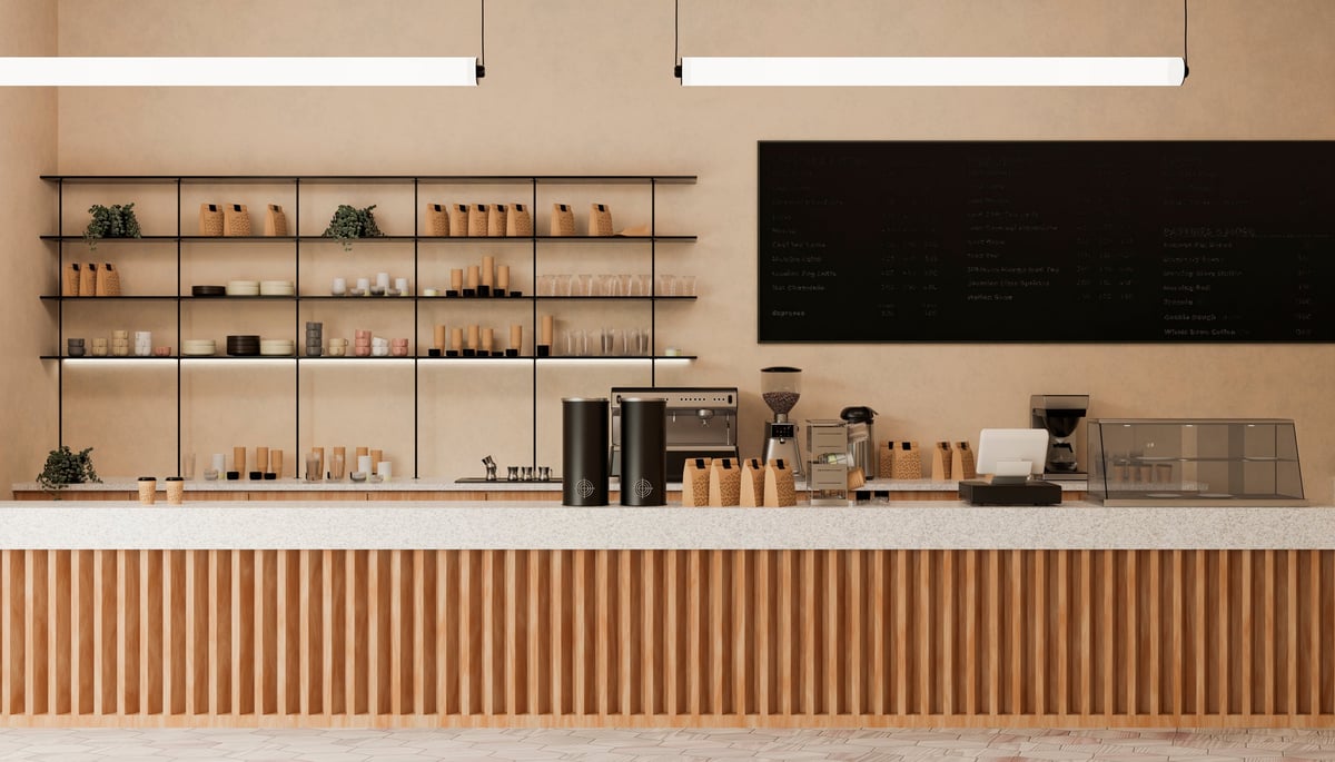 Cafetería moderna con barra de madera que ilustra un soporte QR para menú de café